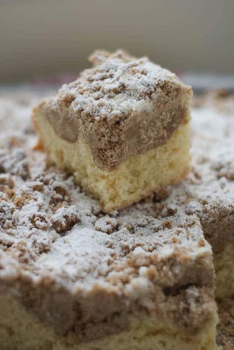 Slice of homemade German Crumb Cake on top of the rest of the cake. German Crumb Cake Recipe, Cake Boss Recipes, Crumb Coffee Cakes, Coffee Cake Recipes Easy, Crumb Cake Recipe, Boss Style, German Desserts, German Baking, Coffee Cake Muffins