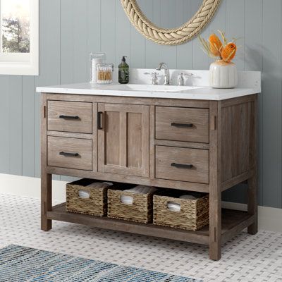 This farmhouse-style single vanity ties together any main bathroom or guest bath. The base is made from solid and engineered wood with a natural wood grain finish, and it comes with a marble countertop and a white ceramic sink. This vanity set features a cabinet with a soft-close door and paneled detailing, as well as four soft-close drawers to tuck away toiletries and washcloths. An open shelf on the bottom is just right for a stack of bath towels. We also love how the sleek black metal handles Simple Wooden Bathroom Vanity, Open Shelving Bathroom Vanity, 46 Inch Bathroom Vanity, Single Sink Bathroom Vanity Ideas, Bathroom Vanity With Vessel Sink, Bathroom Vanity Wood, Rustic Modern Bathroom, 42 Inch Bathroom Vanity, Cement House