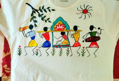 T shirt painting.... Warli Hand Painted Fabric Blouse, Warli Art On Fabric, Warli Painting On Saree, Hand Paint Shirt, Warli Art Designs On Fabric, Warli Embroidery Design, Warli Painting Ideas On Fabric, Painting Ideas On Blouse, Painting Ideas On T Shirt