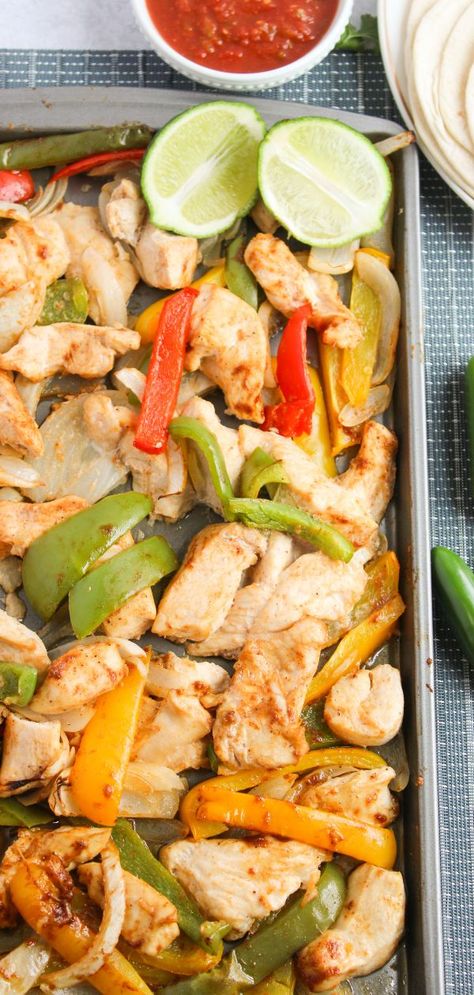 Quick and easy Sheet Pan Chicken Fajitas ready in just 35 minutes! This flavorful dish is packed with seasoned chicken, bell peppers, and onions, all baked to perfection for a hassle-free dinner the whole family will love. Chicken Fajita Sheet Pan Recipe, Easy Chicken Fajita Recipe, Chicken Bell Peppers, Easy Sheet Pan Chicken, Sheet Pan Fajitas, Sheet Pan Chicken Fajitas, Fast Chicken Recipes, Baked Chicken Fajitas, Sheet Pan Dinners Chicken