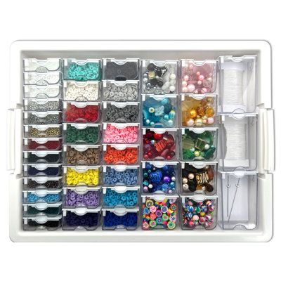 Keep your unfinished projects in order and dust-free with this innovative Bead Storage Solutions Elizabeth Ward Mixed Bead Tray with Jewelry Findings Tray, the ultimate organizer for your jewelry-making needs. The assorted bead tray comes with 42 containers of various sizes and a whopping 14, 785 pieces of beads, 20 yards of stretchy jewelry cord, and 4 beading needles. Meanwhile, the jewelry findings tray comes with 42 containers of various sizes and a whopping 1, 111 pieces of assorted costume Bead Storage Ideas Organizations, Bead Storage Ideas, Beads Organizer, Bead Organizer, Craft Storage Furniture, Sewing Supplies Storage, Bead Organization, Bead Storage, Beading Needles