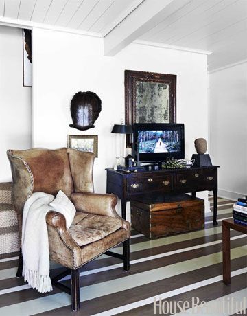 striped wood floor Vintage Modern Living Room, Bill Ingram, Staining Wood Floors, Leather Wing Chair, Painted Wood Floors, Small Cottage Homes, Story Board, Tv Console, Painted Floors