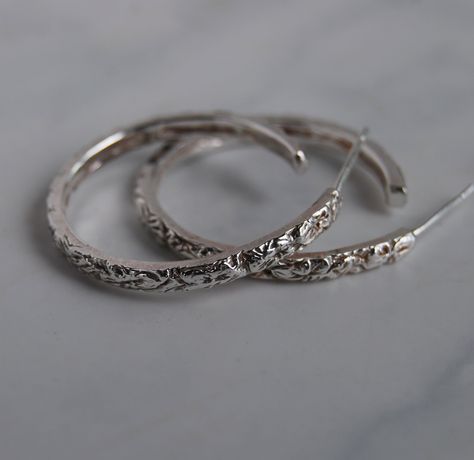 "Hoop Earrings, Sterling silver 3 different sizes, Floral design in a narrow width.  These are carved by me and I also do this in a wider band available in gold or silver. Sizes 1\", 3/4\" and 1/2\" Width 2.5mm Solid Sterling silver Copyright Lstellajewelry 2023" Silver Floral Hoop Earrings, Earrings Aesthetic Silver, Hoop Earrings Aesthetic, Vintage Silver Earrings, Earrings Aesthetic, Indian Jewelry Sets, Jewelry Lookbook, Girly Jewelry, Gull