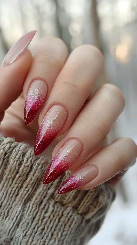 The image shows a hand with long, stiletto-shaped nails. The nails are painted with a red and silver glitter ombre design ->> more details in ai-img-gen.com Red Ombre Nails Design, Red Modern Nails, Red Nail With Glitter, Red Nail Ombre, Red Detail Nails, Ombre Nails Almond Shape, Red Glitter Ombre Nails, Silver Red Nails, Red Nails Ombre