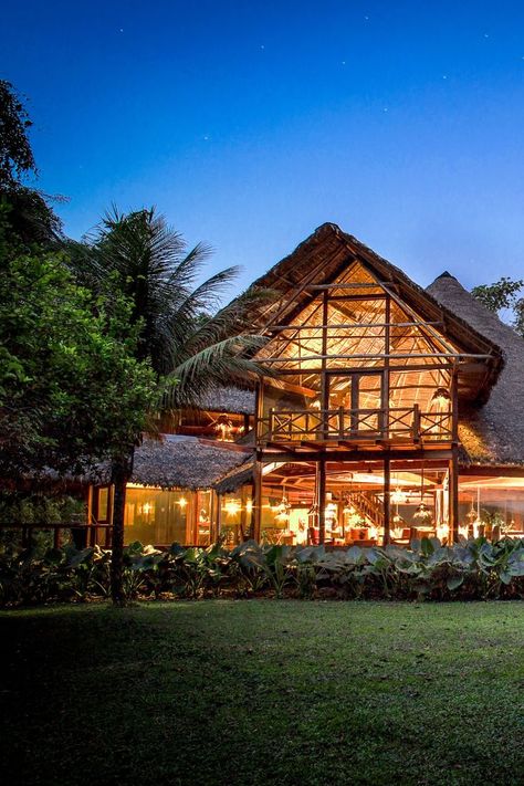 The Inkaterra Reserva Amazonica lodge lit-up at night in Puerto Maldonado, Peru Amazon Rainforest Travel, Peru Jungle, Brazil Amazon Rainforest, Brazil Rainforest, Peru Amazon, Peru Itinerary, Puerto Maldonado, Brazil Amazon, Eco Resort