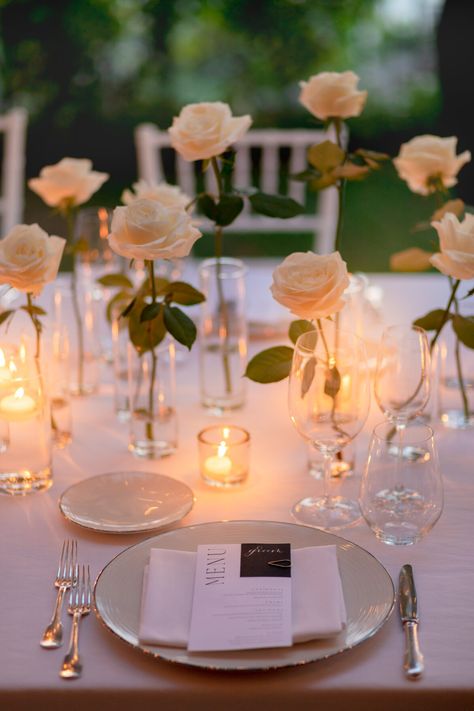 White roses and flickery candles set up for romantic reception in Hotel Caruso's olive garden, Amalfi Coast wedding All White Wedding Reception Romantic, Romantic Round Table Setting Wedding, Candle Tablescapes Wedding Round, Roses And Candles Wedding, Belmond Hotel Caruso, Brazil Wedding, Rose Centerpieces Wedding, Candle Light Wedding, Candles Reception