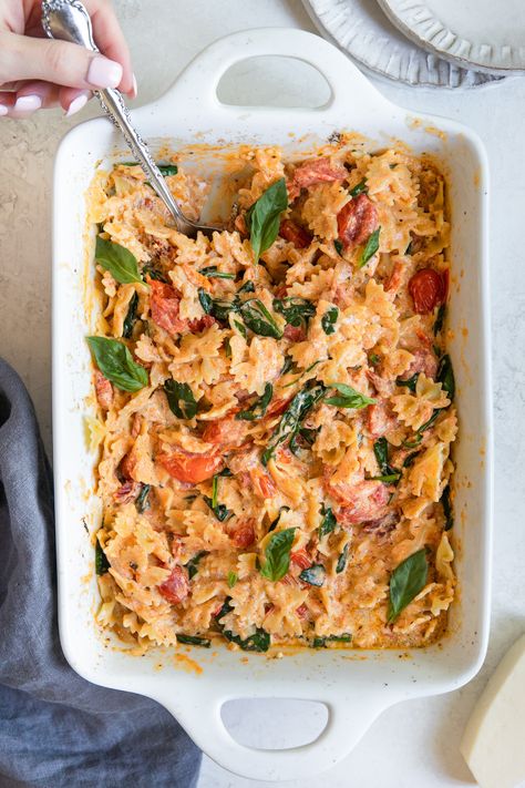 This Cream Cheese Pasta Bake is a simple recipe made by oven roasting a block of cream cheese with cherry tomatoes and a few other basic ingredients to create a creamy, flavorful sauce. #comfortfood #pasta #familydinneridea #dinnersforkids #tiktokpasta #creamcheesepasta #dinner #dinnerideas #creamcheesepastabake Vegetarian Recipes With Cream Cheese, Cream Cheese Tomato Pasta Bake, Tomato Cream Cheese Pasta, Pasta Bake With Cream Cheese, Cream Cheese Pasta Bake, Easy Weeknight Pasta, Cheese Pasta Bake, Weeknight Pasta, Cream Cheese Pasta