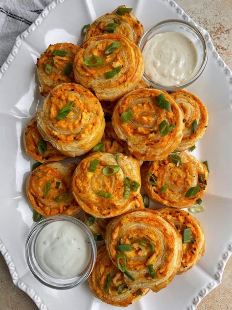 Buffalo Chicken Pinwheels - thechowdown Pinwheel Recipes Easy, Air Fryer Puff Pastry Recipes, Easy Pinwheel Recipes, Chicken Apps, Buffalo Chicken Pinwheels, Easy Buffalo Chicken Dip, Puff Pastry Pinwheels, Chicken Pinwheels, Chicken Puffs