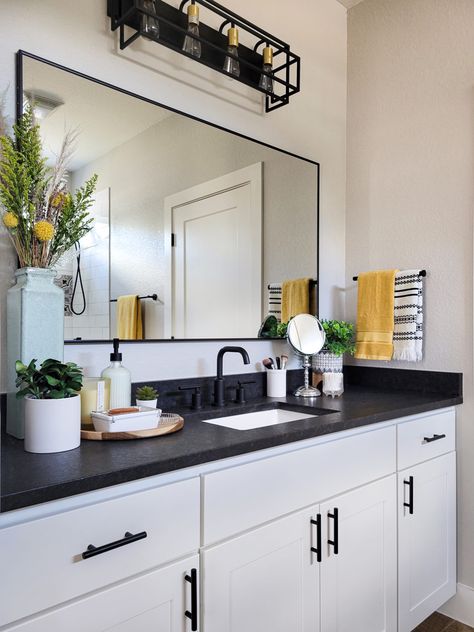 Guest Bathroom Ideas Black Countertop, Black And White Cabinets Bathroom, Black Countertop In Bathroom, Boho Bathroom Black Countertop, Black Bathroom Granite Countertops, White Vanity Dark Countertop, Bathroom Interior Design Dark Countertop, Black Counter White Cabinets Bathroom, Black Countertop Bathroom Decor