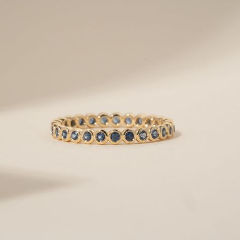 Timeless, elegant & dainty, this rich shade of blue will make you feel like royalty each time you gaze at your hand! This can be your vibrant and unique wedding band, yet also the perfect dainty ring to add a pop of color to your solid gold ring stack. This is a full eternity band surrounding the entire finger. Choose your metal and size, and we will make it custom for you. September's birthstone is a stunning ring to stack with your wedding ring! - Handmade - Solid Gold - Natural Blue Sapphire - Total Sapphire Carat Weight: 1 ctw for size 6.5 - Width of the Band: 2.5 mm - Height of the Band: 1.7 mm 🛠 Your Sarah Elise piece is handcrafted with care! Ready-to-ship items go out within 3 business days. Made-to-order pieces typically take 7-10 business days to create. If you need something so Bezel Eternity Band, Birthstone Wedding Ring, Sapphire Eternity Band, Sapphire Eternity Ring, Handmade Fine Jewelry, Unique Wedding Bands, Wedding Ring Set, Jewelry Lookbook, Eternity Band