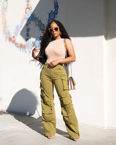 Serving effortless cool in our must-have cargo pants paired with a sleek nude bodysuit. This look is all about confidence and comfort with a touch of edge. Get yours now at www.shopkosmios.com. ✨  #StreetStyle #CargoPants #FashionForward #EffortlessStyle #ShopKosmios #TrendAlert #FallFashion #StyleInspo #OOTD #KosmiosStyle Cargo Wide Leg Pants, Wide Leg Pants Outfit, Feeling Inspired, High Risk, Cute Simple Outfits, Spring Summer Outfits, Fall Winter Outfits, Trendy Dresses, African Dress