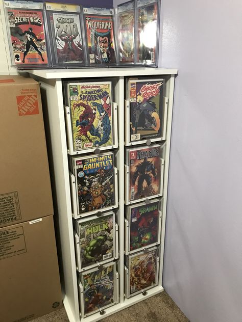 DIY comic book display cabinet! Completed in 5 days. Thank you to Chris Faulkner for the inspiration. Comic Book Cabinet, Comic Book Display Ideas, Comic Book Storage Ideas, Comic Book Wall Display, Comics Display, Comic Themed Room, Comic Book Organization, Collector Room, Diy Comic Book