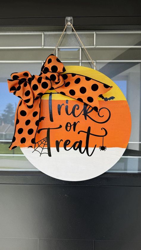 This is a 12" wooden circle door hanger.  Perfect for your front door, or inside on your closet door, bathroom door, bedroom door, inside garage door or simple a wall decoration.  It reads "Trick or Treat" and is painted in candy corn colors.  The bow is orange with black polka dots.  Perfect addition to your Halloween decor! This is already made and ready to ship to your home today! Wooden Circle Door Hangers, Inside Garage Door, Paint Plates, Circle Door Hanger, Circle Door, Office Door Signs, Door Bedroom, Door Inside, Door Hangers Diy