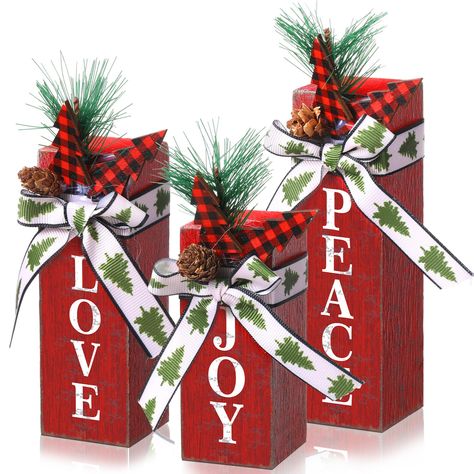 PRICES MAY VARY. Package Contents: You will receive 3 pieces of Christmas wooden faux blocks in different sizes, which can meet your decoration needs in many places, you can also share with others, and bring a strong Christmas atmosphere to your Christmas party Festive Christmas Design: Our Xmas rustic table centerpieces are in classic Christmas red and green colors, with a bow design on the top, paired with pine cones, pine needles, red and black buffalo plaid Christmas trees, etc.; The decorat Wood Projects Christmas Decor, Christian Christmas Table Centerpieces, Wooden Christmas Boxes, Black White Red Christmas Decor, Christmas Centerpiece For Round Table, Christmas Party Centerpieces Diy, Christmas Decorations For Church, Christmas Party Table Centerpieces, Small House Christmas Decor