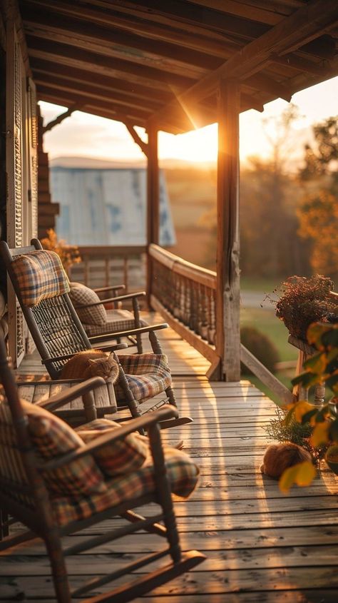 Cozy porch setting at sunset with rocking chairs, cushions, hydrangeas, and pumpkins. Ideal spot for relaxation and unwinding. Rocking Chair Porch Aesthetic, Cozy Porch, Rocking Chair Porch, Wooden Deck, Hydrangea Not Blooming, Wooden Decks, Sun Sets, Rocking Chairs, Cozy Atmosphere