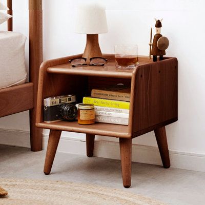 The nightstand is made of high-quality solid beech wood that's not only durable but also safe for your health. The natural and harmless wood finish gives it a bright and charming look, making it a perfect addition to any bedroom decor. Featuring a large open storage compartment, this bedside table provides ample space to store your items and keep your room organized. The fenced tabletop keeps your belongings from sliding off, while the back cable hole allows you to charge your electronic devices Bedside Cabinet Modern, Simple Nightstand, Mid Century Modern Nightstand, Small Nightstand, Nordic Bedroom, Wood Bedside Table, Into The Wood, Bedside Night Stands, Modern Nightstand