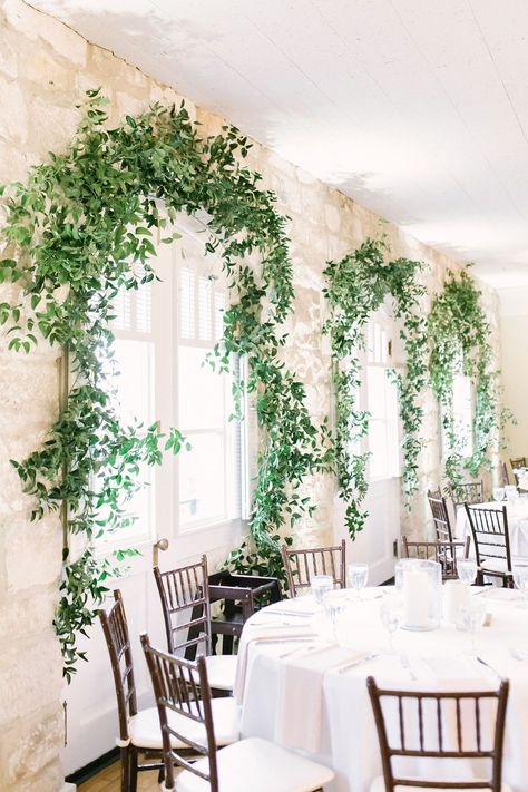 Stems Floral Design | Chateau Bellevue | Blue Moon Events | Kate Elizabeth Photography | | | ...Greenery in the Reception Area Smilax Inspiration Indoor Reception Stone Wall Light and Airy Wedding Greenery Over Doorway, Smilax Arch, Ivy Wedding Decor, Smilax Wedding, Wedding Vines, Wedding Entries, Smilax Vine, Stone Wall Light, Foliage Wedding Decor