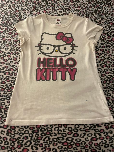 Rare-ish Mighty Fine nerd Hello Kitty shirt! Shows Hello Kitty with “nerd” glasses and her name in black and pink underneath her Hello Kitty Shirt Design, Hello Kitty Fits Y2k, Pink Hello Kitty Graphic Tee, Hello Kitty T-shirt, Hello Kitty Shirt Outfits, Hello Kitty Y2k Aesthetic, Nerd Hello Kitty, Darker Outfits, Hello Kitty Tshirt