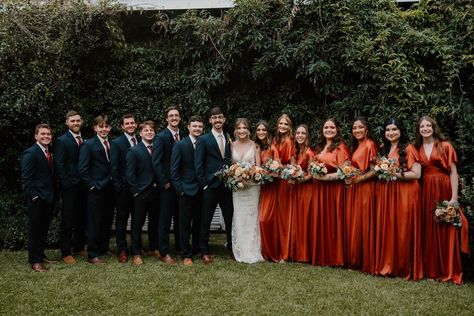 October Fall Wedding Bridal Party Bride Groom Bridesmaids Groomsmen Navy Suits Burnt Orange Dresses October Wedding Suits, Groomsmen Attire Navy Blue And Burnt Orange, Blue Suit And Orange Dress, Navy Blue And Burnt Orange Wedding Suit, Navy And Rust Bridal Party, Burnt Orange And Navy Wedding Party, Fall Wedding Suits For Men Burnt Orange, Burnt Orange Bridal Party Groomsmen, Navy Blue Tux With Burnt Orange