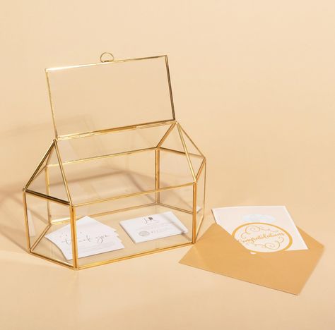 PRICES MAY VARY. PRODUCT – Hanna Roberts Card and Gift Holder Golden Brass Glass Cards Box for Weddings, Birthdays, Parties, and Bridal Showers (Full Opening) USE – This is beautiful and chic gold toned glass box is ideal for any special occasions, including weddings, birthdays, graduations, showers, and parties, to hold your gifts and cards. Its minimalistic and simple design will suit any style DESIGN - Gold brass lining around the geometric glass box MATERIAL/SIZE - Glass, Metal, 13.18" x 7.8 Gold Card Box Wedding, Gold Card Box, Diy Card Box, Rustic Card Box, Rustic Card Box Wedding, Wedding Card Box, Gift Holders, Glass Box, Fun Wedding Invitations