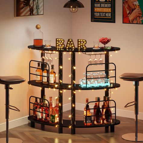 PRICES MAY VARY. Large Open Storage Space: This 3-tier liquor bar unit with curved design and 2 large shelves offer ample space to store items, 4 front guard rails keep items from accidental spill. It’s suitable for displaying wine and wine accessories, meeting your storage needs Durable and Stable Construction: This bar cabinet is consisted of solid metal frame, wear-resistant MDF material. The thick metal frame makes it sturdy enough and has strong load-bearing capacity. 6 Legs make it more st Liquor Bar Cabinet, Shelves Corner, Home Kitchen Bar, Alcohol Bar, Corner Bar, Home Bar Rooms, Bar Unit, Cabinet With Storage, Liquor Bar