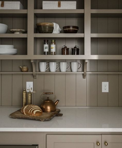 Pantry detail from @caliberhomes. Nickel gap paneling runs vertically from counter-top through the open shelving. A decorative wooden bracket holds up a shallow shelf for coffee mug display. #pantrydesignswelove #pantry #pantryideas #kitchendetails #homeinspo #homeinspiration #pantryinspiration #coffeemugdisplay #coffeebar Shallow Shelf, Shallow Pantry, Nickel Gap, Wooden Shelves Kitchen, Shallow Shelves, Pantry Inspiration, Coffee Mug Display, Georgia House, Classy Kitchen