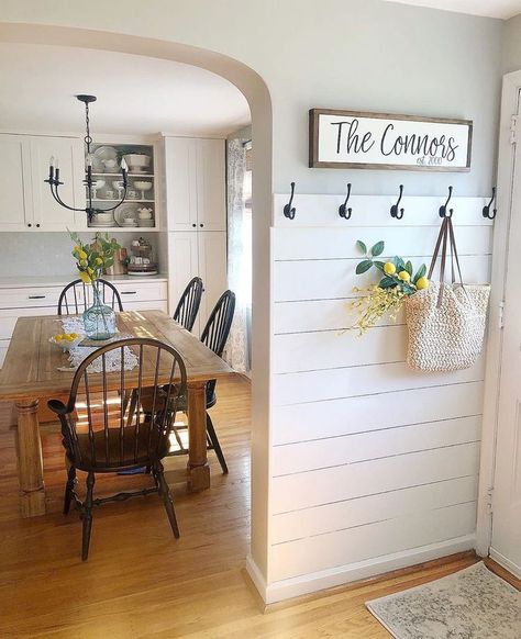 A new farmhouse trend is a half-wall with shiplap on it. This entryway looks incredible, and I’d love to see this in your home! Would you put this in your home? If not, what other  design trend would you rather have in your home?   #newlisting #justlisted #knoxvillehomesforsale #forsale #knoxvillehomes #knoxvillelistings #knoxvilleproperties #knoxvillerealtors #knoxvillerealestate #househunting #moveinready #homeforsale #ThePriceIsRight Entry Way Ideas Shiplap, Small Entry Way Mud Room Ideas, Ideas For Small Entry Ways Entrance, Kitchen Entry Wall Decor, Hooks On Shiplap Wall, Wall Hooks Decor Ideas, Entryway In Dining Room, Shiplap With Hooks Entry, Front Door Room Ideas