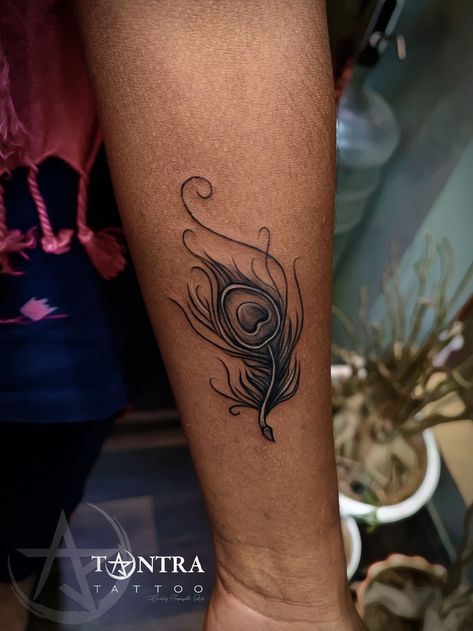 Peacoke Feather Tattoos, Black Peacock Feather Tattoo, Peacock Feather Tattoo Design For Women, Peacock Tattoo Feather, More Pankh Tattoo, Peacock Feather Tattoo Small, Feather Tattoo Design For Women, Krishna Feather Tattoo, Coverup Tattoo Ideas For Women