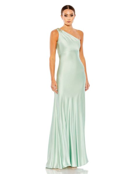 Elegance is instantly achieved the moment you slip into this charmeuse gown. The luxe, silky slip dress is cut in a body-skimming silhouette styled with a single shoulder topped by a “brooch” of rhinestones and beads, a sophisticated cutout back, and godet pleats. Wear the gown now and for future formal events. Mac Dug Simple Formal Dress, Mac Duggal Prom, Green Evening Gowns, Vestidos Color Coral, Mac Duggal Dress, Sheath Gown, Bodice Top, Mac Duggal Dresses, Column Gown