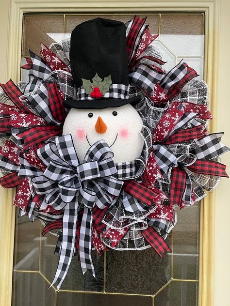 this wreath will not be available til October 1, 2024 Winter snowman wreath front door decor is a festive holiday seasonal wreath for Christmas, ideal for living room decoration. It's perfect for a new home, adding a touch of home decor for December. Overview: 🌺handmade item 🌺Made to order 🌺Ships in the US only Itemized list: 🌺24" finished wreath 🌺10" mesh  🌺snowman head 🌺 1 1/2" wired ribbon 🌺 2 1/2" wired ribbon 🌺wired wreath 🌺 metal sign Production & shipping 🌺1-2 week production ? Wreath For Christmas, Candy Wreath, Christmas Living Room, Deco Mesh Christmas Wreaths, Candy Cane Wreath, Christmas Mesh Wreaths, Wall Wreath, Winter Snowman, Christmas Front Doors