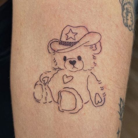 https://instagram.com/emmakashif?igshid=MjkzY2Y1YTY= Teddy Bear Drawing Tattoo, Cowboy Teddy Bear Tattoo, Teddy Bear Tattoo Aesthetic, Bear Tattoo Aesthetic, Stuffed Animal Tattoo Simple, Bear Tattoos Cute, Sweethearts Tattoo, Childhood Stuffed Animal Tattoo, Plushie Tattoo