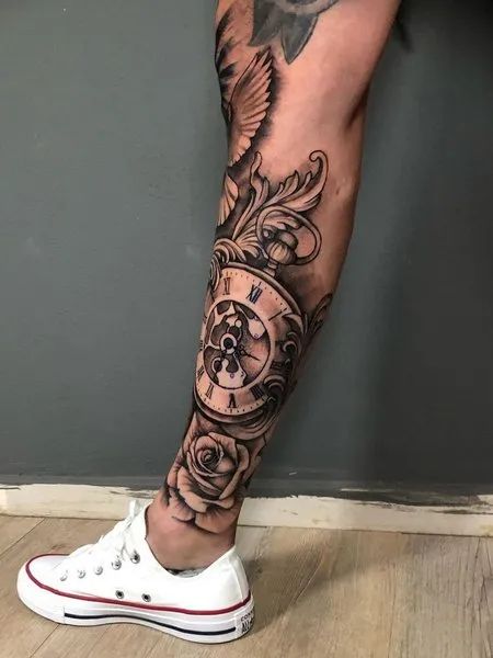 Clock Leg Tattoo Men’s Shin Tattoo Ideas, Clock Tattoo Design For Men Leg, Clock Leg Tattoo Men, Lighthouse Tattoo Men Leg, Family Leg Tattoo Men, Bottom Leg Tattoo Men, Lower Leg Sleeve Tattoo Mens, Lower Leg Tattoo Sleeve, Men Shin Tattoo