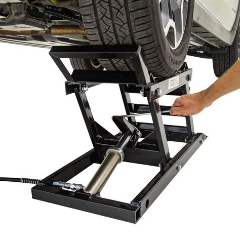 This set of two Black Widow Hydraulic Car Lifts with Ramps is designed for professional or home garage use as an alternative to jacking up your vehicle and setting it on jack stands. The ramped design allows you to drive up and onto the lift platform, and a foot pedal raises the lift hydraulically from 5" to 15". Sold as a pair, this car lift provides ample access for oil changes, underbody work and simple repairs, and supports up to 3,000 lbs. Truck Shop Garage, Diy Car Ramps, Home Car Lift, Hydraulic Car Ramps, Garage Car Lift, Car Lifter, Portable Car Lift, Hydraulic Car Lift, Car Hoist