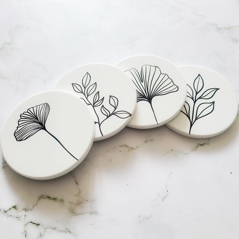 This Minimalist Coaster Set is designed to elevate your home decor. Its sleek and modern design add a touch of sophistication to any tabletop. The set has a clean and crisp look that suits any interior aesthetic. Crafted from high-quality materials, this coaster set is designed to stand the test of time. The minimalist style of each coaster gives you the perfect accent to any table setting. Comes in a set of 4 -Durable -Cork backing -Waterproof -Minimalist Design If you have any questions, feel free to message me and I'd be happy to answer them. Creative Coaster Design, Unique Coaster Designs, Diy Coaster Painting Ideas, Painted Wooden Coasters, Diy Pottery Painting Ideas Simple, Coaster Art Ideas, Ceramic Coaster Ideas, Coaster Design Ideas, Cricut Coasters