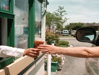 A driver reaches for her coffee order through a window at a drive-up Starbucks Coffee shop June 23, 2000 in Lombard, IL. Legislators in New Jersey want to pass a… Drive Through Coffee Shop, Coffee Drive Thru, Starbucks Drive Thru, Drive Thru Coffee, Distracted Driving, Pray For America, Jitterbug, Architecture Collage, Basic Knowledge