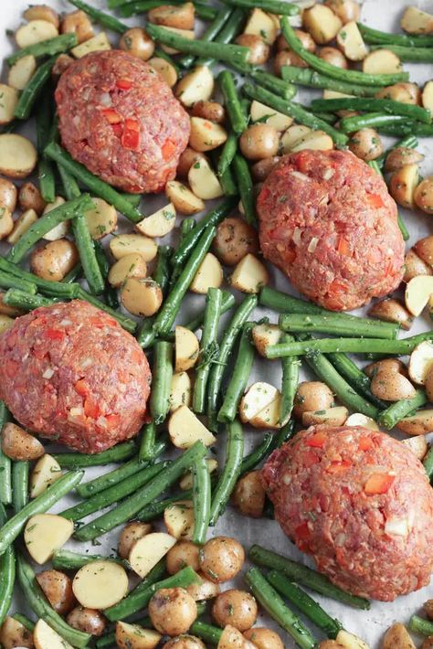 BBQ Meatloaf Sheet Pan Dinner- This quick weeknight dinner is a comfort food classic made-easy that is also packed with flavor. Veggie-filled mini meatloaves are topped with barbecue sauce and then surrounded with buttery baby dutch yellow potatoes and green beans dressed in simple herb oil. #cookingandcussing #easydinner #onepot #sheetpandinners #meatloaf #30minutemeal easy beef sheet pan dinner // southern comfort food // weekday dinner ideas Meatloaf Sheet Pan Dinner, Baby Dutch Yellow Potatoes, Weekday Dinner Ideas, Dinner Southern, Barbecue Meatloaf, Bbq Meatloaf, Mini Meatloaves, Meatloaf Dinner, Potatoes And Green Beans