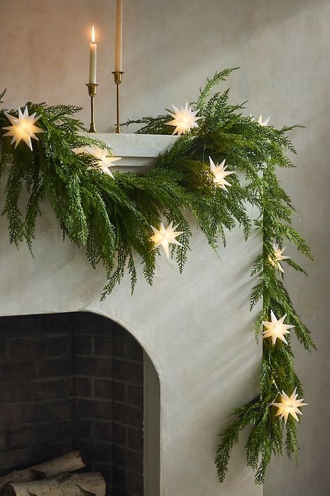 Simple, elegant designs with a focus on fewer, high-quality decorations. Neutral colors, like whites and earthy tones, paired with natural elements like pinecones and greenery, create a serene atmosphere. Classy Winter Decor, Christmas Greenhouse, Faux Cedar Garland, Cedar Garland, Moravian Star, Star String Lights, Classy Christmas, Unique Christmas Decorations, Classy Tattoos