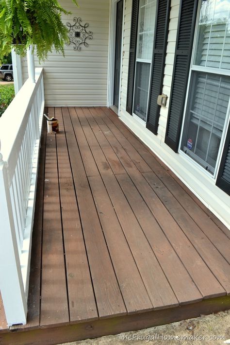 Front porch makeover (decorated for summer in red, white, and blue White And Wood Front Porch, Porch Stoop Makeover, Front Porch Wood Stains, Black Stained Front Porch, Refinish Wood Porch, White House Wood Porch, Deck Stain Colors For White House, Tan House Front Porch, Tan House Porch Color Ideas