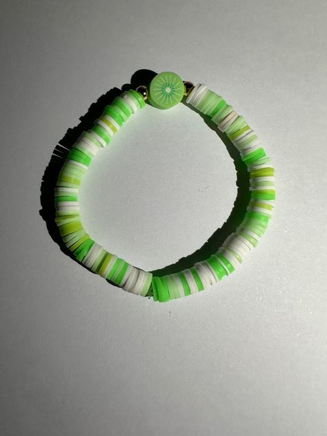 A cute green bracelet with a green kiwi and gold beads only for £3.00! Clay Beads Bracelet, Green Bracelet, Beaded Jewlery, Green Clay, Beads Bracelet, Clay Beads, Gold Beads, Kiwi, Beaded Bracelets