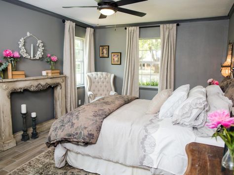 A statement piece in the remodeled bedroom is a French antique mantel, dating to the turn of the last century, used as a decorative wall feature. Fixer Upper Bedroom, Fixer Upper Bedrooms, Hgtv Fixer Upper, 70s House, French Country Bedrooms, Slaap Lekker, Bedroom Pictures, Blue Room, Ideas Hogar