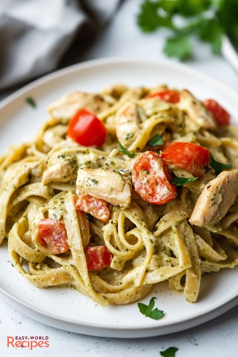 Creamy Chicken Pesto Pasta is a quick and easy dinner recipe combining tender chicken, al dente pasta, and a rich, velvety basil pesto sauce. Quick Pesto Pasta, Basil Pesto Chicken Pasta, Creamy Chicken Pesto Pasta, Pesto Pasta Recipes Chicken, Basil Pesto Chicken, Chicken Pesto Pasta, Creamy Pesto Chicken Pasta, Basil Pesto Pasta, Creamy Pesto Pasta