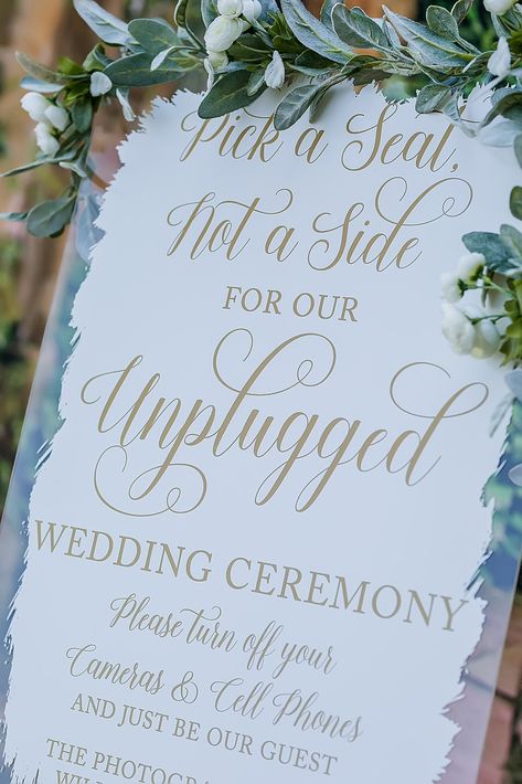 "Click on the following link to browse HUNDREDS more designs in our shop!! https://pinkposiesandpearls.etsy.com/  | Welcome to Pink Posies and Pearls Wedding and Gift Boutique | Make a grand statement at your wedding with our acrylic signs! This acrylic is a display material that is strong, moisture resistant & visually clearer than glass, not to mention shatterproof! The lettering can be selected from your unique color palette. No vinyl or stickers are used! We print on your design with high quality, UV ink, which make it a permanent design (no wrinkles, peeling or bubbles like with vinyl). It is personalized with the Bride and Groom's names and wedding date. This beautiful sign provides an easy way to add an elegant and custom touch to your wedding or next special event. Choose your cust Pick A Seat Not A Side Unplugged, Unplugged Wedding Sign Acrylic, Pick A Seat Not A Side Wedding Sign, Pick A Seat Not A Side Sign, Pick A Seat Not A Side, Bond Wedding, Acrylic Wedding Signs, Unplugged Ceremony Sign, Unplugged Ceremony