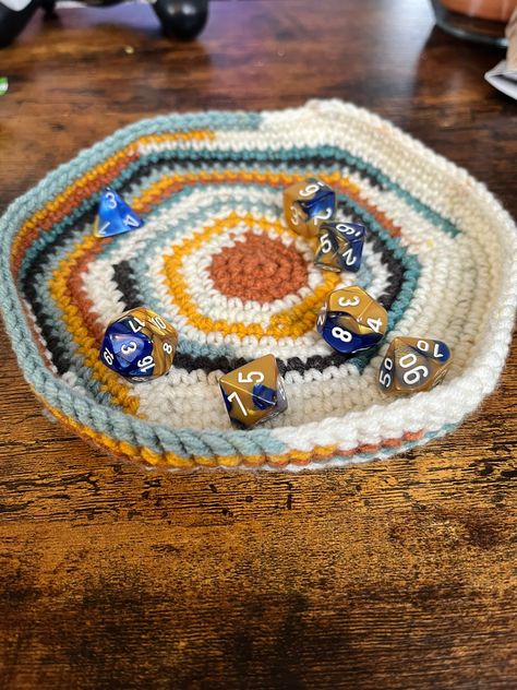 This crochet dice tray is wonderful for keeping your dice on the table! Since it's made of yarn, it almost eliminates the loudness of normal dice rolling trays making it perfect for anyone sensitive to loud noises. Did I mention it's super portable? Since it's crochet it can easily fold up or be rolled up for easy transportation! Secondary color is the bottom color, for example if the primary is black and the secondary is red, the border will be black and the bottom will be red Dice Tray Pattern, Crochet Dice Tray, Crochet Trinket Tray, Crochet Tray, Crochet Games, Crochet Dice Bag, Leftover Yarn Project, Crochet Dice, Crochet Game