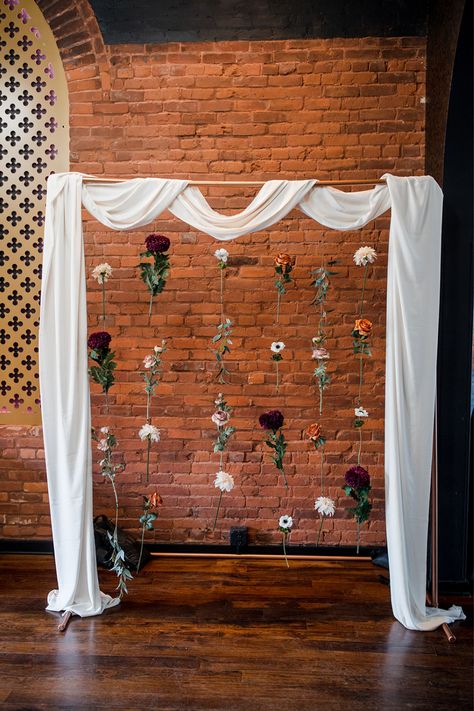 photo backdrop with white draping and hanging flowers Hanging Wedding Backdrop, Drape Photo Backdrop, How To Hide Walls For A Wedding, Pvc Wedding Backdrop, Easy Diy Photo Backdrop Wedding, Romantic Photo Backdrop, Backdrop Alternatives, Wedding Alter Background, Flower Garland Arch