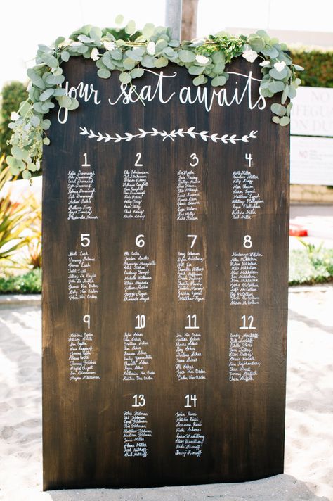 Your seat awaits: http://www.stylemepretty.com/california-weddings/newport-beach/2015/10/23/relaxed-rustic-newport-beach-wedding/ | Photography: Rachel Jane - http://racheljanephoto.com/ Wedding Table Assignments, Rustic Seating Charts, Diy Outdoor Weddings, Rustic Outdoor Wedding, Flowers And Greenery, Outdoor Wedding Decorations, Seating Chart Wedding, Wedding Signage, Wedding Seating