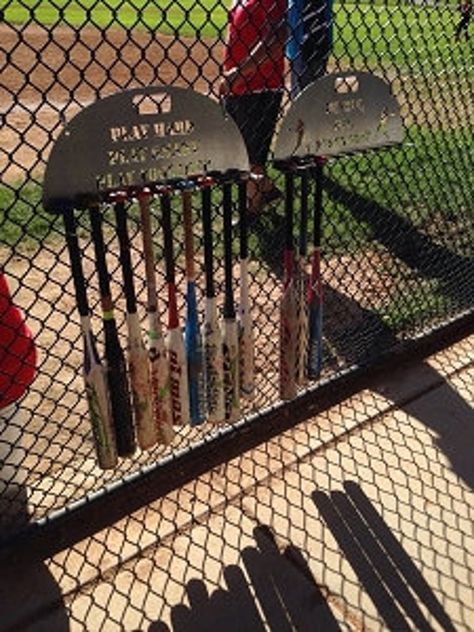 "Metal bat holders to hang on the fence in your dugout.  You can have one of our sayings or send us your favorite saying, team name or whatever you would like. These are cut with a laser out of sheet metal, 18 gauge, ready for you to paint your team color or just leave the metal look. Measure about 23.5\"x 11.5\" and will hold up to 9 bats.  You will need to provide your own way of hanging them.  We have found carabiners or \"S\" hooks work great. PLEASE TYPE IN NOTES TEAM NAME/SAYING,  SPELL EX Metal Bat, Medal Holders, Team Name, The Fence, Sheet Metal, Team Names, Team Colors, Softball, Baseball Bat