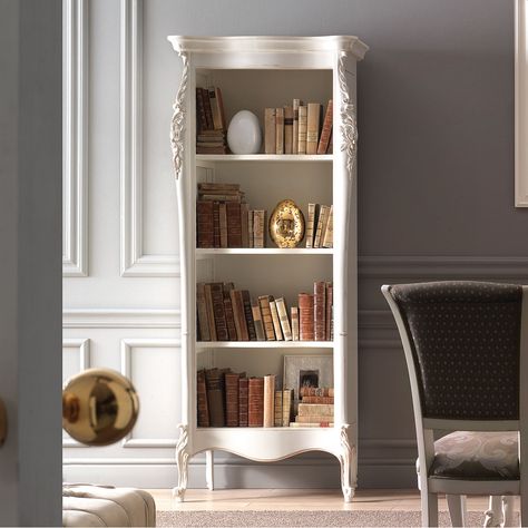 Elegant and refined open bookcase, intended for exclusive and classy home. Shaped shoulders with an evident notch in the upper and lower part. Shaped hat with frame and base raised from the ground by feet ending in a curl. Adjustable shelves on a wooden ladder. The delicate but important shapes are decorated with richly carved details. This bookcase can be inserted within classic furniture or in a modern context, as a strong contrasting element. It is certainly a piece of furniture destined to l Parisian Bookshelf, Bookcases Uk, Classic Bookshelves, Farmhouse Bookshelf, French Bookcase, Living Classic, Open Bookshelves, Classy Home, Open Bookcase