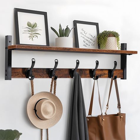 PRICES MAY VARY. No 【29inch Large Wall Shelf Storage】2 in 1 wall hooks with shelf have functions both hang & display; The shelf for wall wide enough to display books, frames and vases; Suitable for living room,laundry room,bathroom and kitchen, etc. 【80 lbs Super Bearing Capacity】Combining sturdiness and beauty, the upgraded wall mounted coat hook are thicker and stronger, supporting up to 80 lbs, crafted from premium metal for long-lasting durability 【Wall-mounted Aesthetics】 This wall mounted Entryway Hat Rack, Shelf With Hooks Underneath, Floating Shelves In Entryway, New Home Must Haves Products, Hanging Backpacks On Wall, Bench And Hooks Entryway, Entryway Wall Hook Ideas, Entryway Hanging Hooks, Entry Way Hooks And Shelf