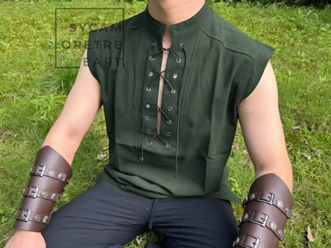 Army Green Viking Medieval Shirt, Renaissance Viking Vest with Armor, Mens Plus Size Medieval Tunic, Gothic Pirate Tunic Shirt Costume Material: Cotton Product Factors: Gender: Unisex Special Use: Costumes Source: Medieval Pants Source Type: Historical Our cotton and linen pants, inspired by medieval/Viking styles, are designed for comfort and realism, showcasing individuality. This pair of pants features a classic elastic waistband that fits perfectly, while the lace up calf adds a touch of med Medieval Larp Costume, Mens Medevil Fashion, Medival Shirt, Druid Cosplay Male, Mideaval Outfits Male, Casual Medieval Outfits, Casual Pirate Outfit, Mens Ren Faire Outfit, Plus Size Medieval