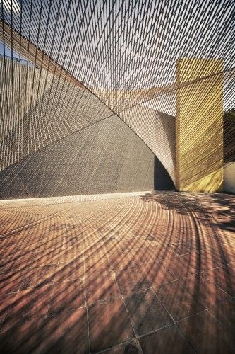 "Eco Pavilion": Extending the play of angles and light that are one the hallmarks of the Museo Experimental Eco (by artist Matthias Goeritz, 1953), this award-winning temporary pavilion uses parallel lines of rope to define a parabolic "roof" above the central courtyard. | 2011, MMX Detail Arsitektur, Pavilion Design, Shade Structure, Space Architecture, Architectural Inspiration, Travel List, Green Building, Urban Design, Amazing Architecture